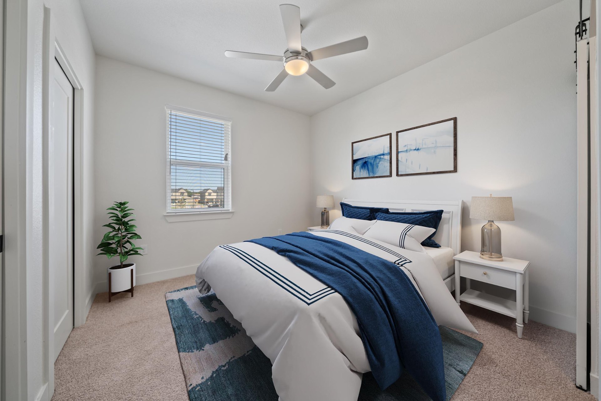 Bedroom with queen bed and ceiling fan