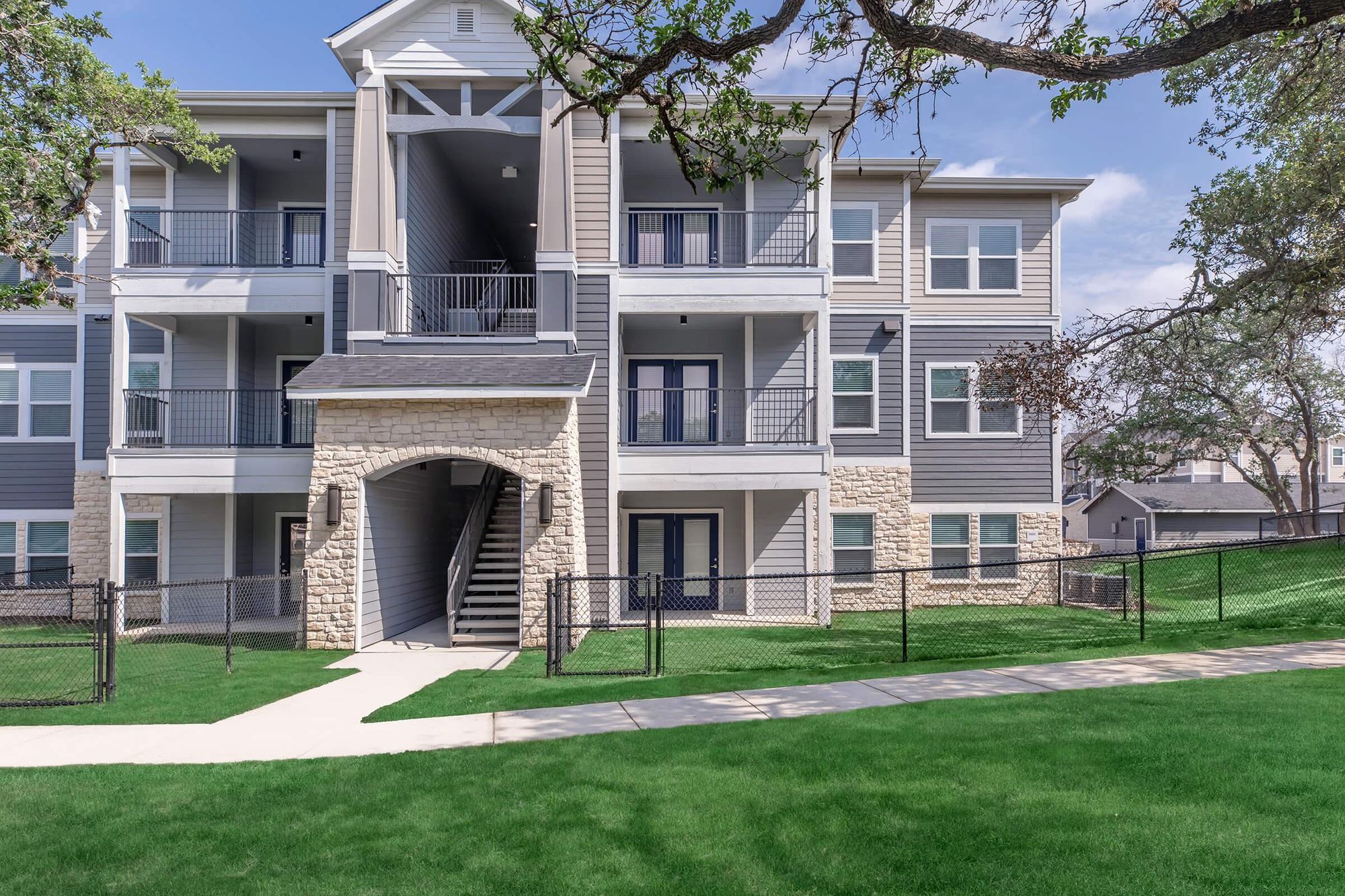 Apartment building exterior with stone entry