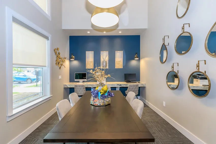 Business center with conference table and workstations
