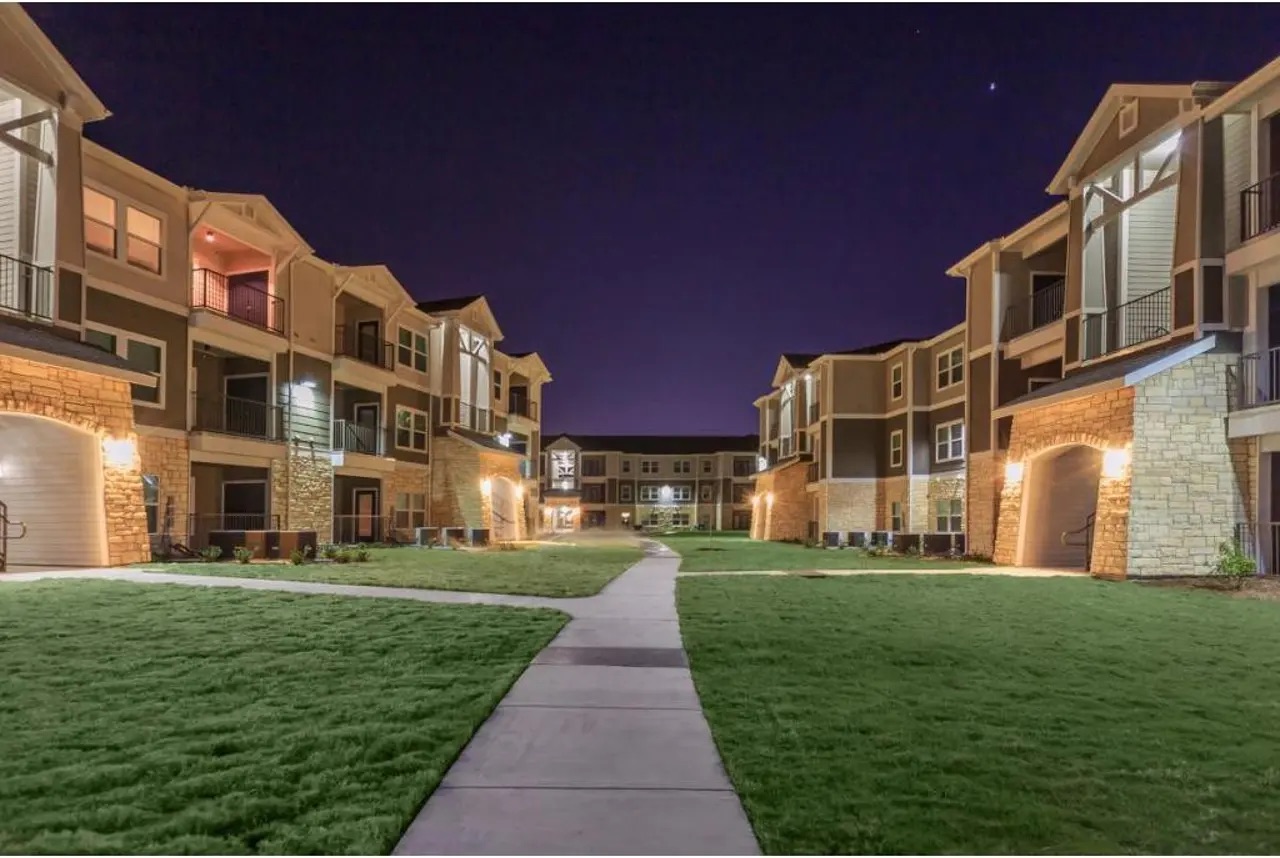 Illuminated courtyard walkway at night