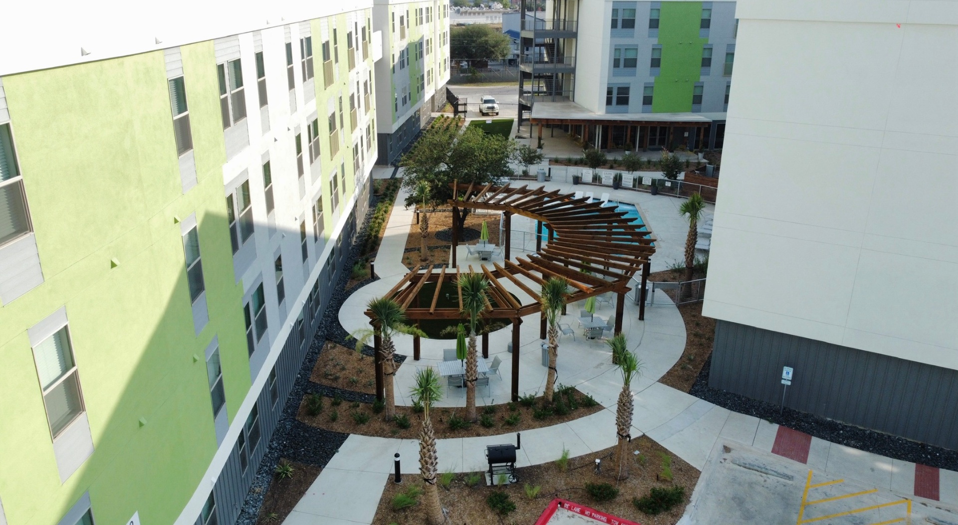 Aerial view of curved pergola and pool in the courtyard