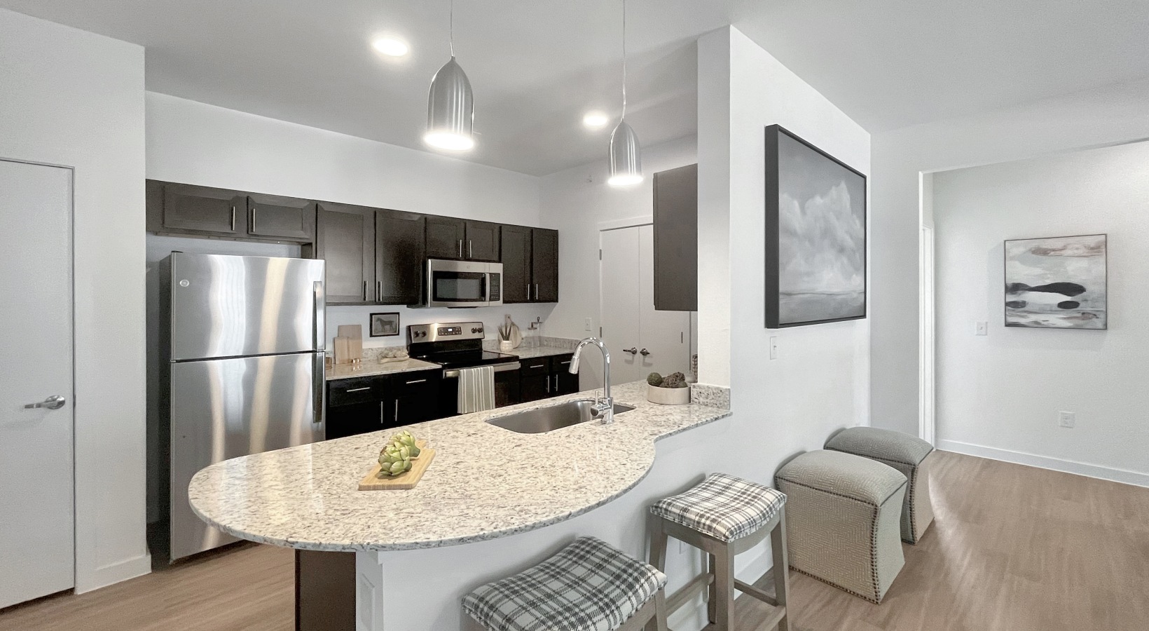 Kitchen with granite island and stainless appliances