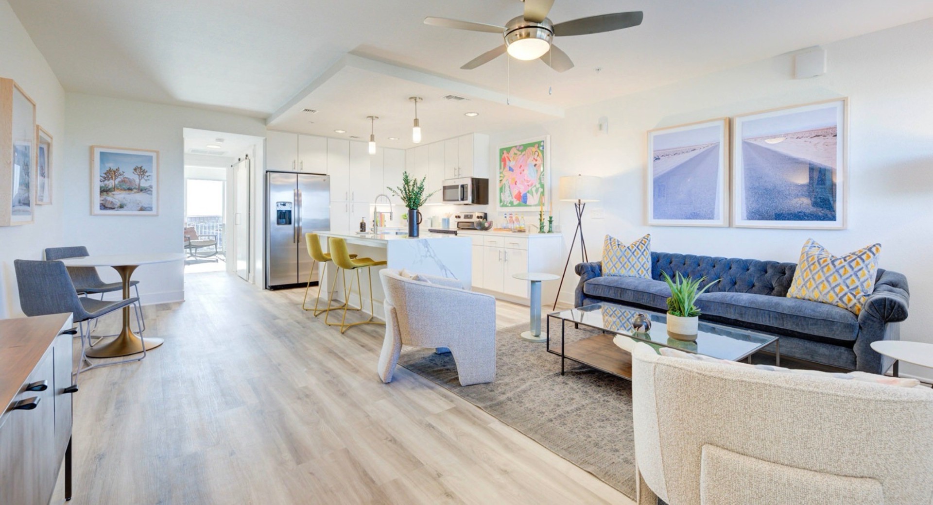 Furnished open-plan living and kitchen with city views