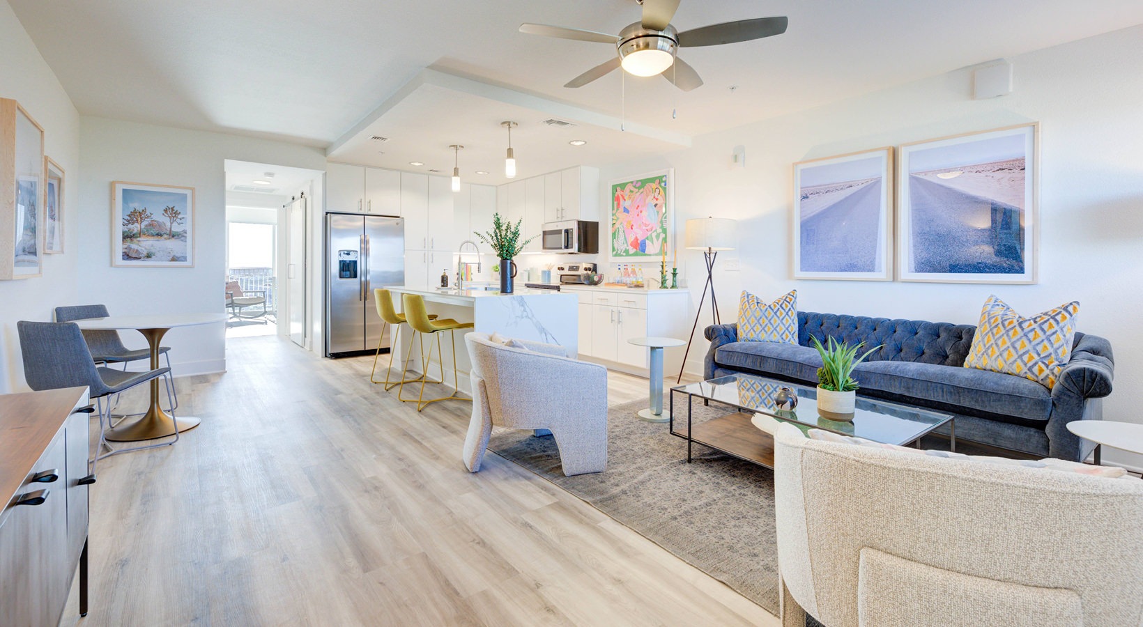 Open-concept living, dining and kitchen with natural light