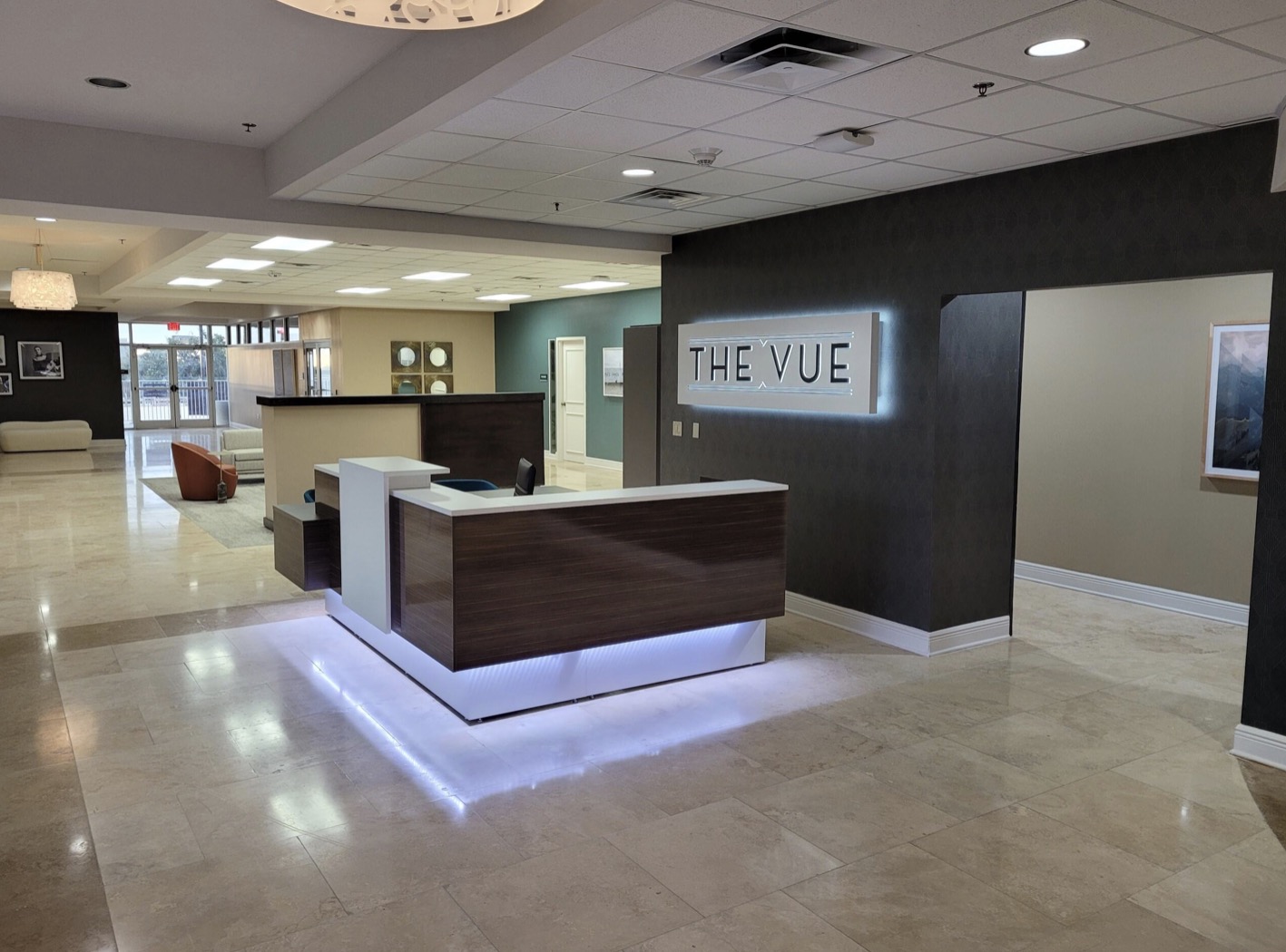 Lobby reception desk with backlit signage